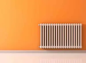 Radiator on orange wall
