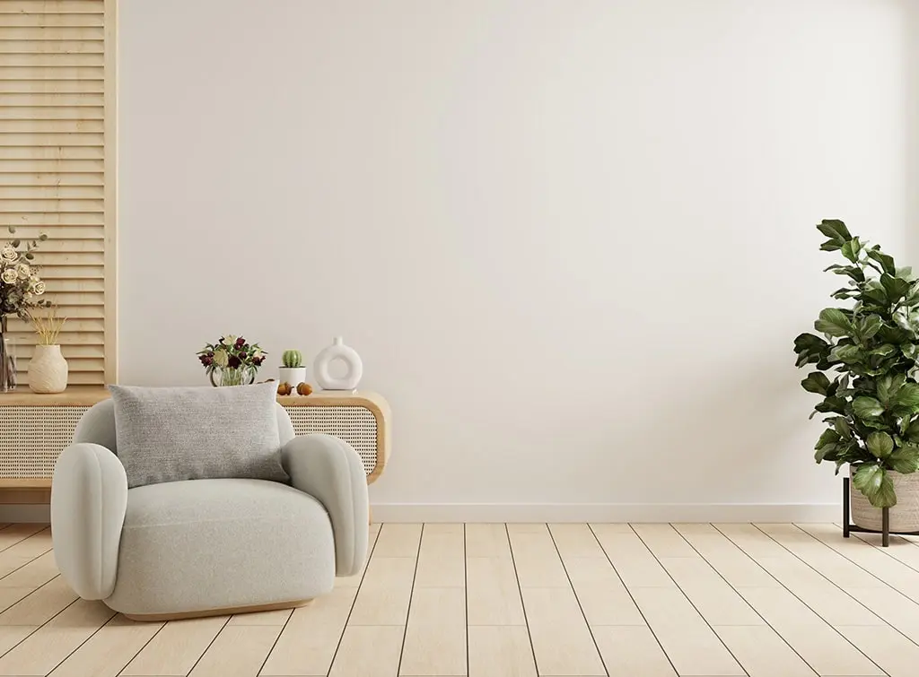 A curved armchair in a neutral living room