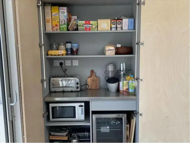 https://www.checkatrade.com/blog/wp-content/uploads/2023/08/Kitchen-appliance-garage-manufacturer-DG-Kitchens.jpg