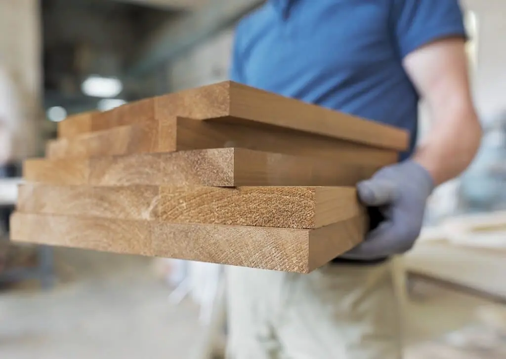 https://www.checkatrade.com/blog/wp-content/uploads/2024/06/carpenter-with-wood-1024x727.jpeg