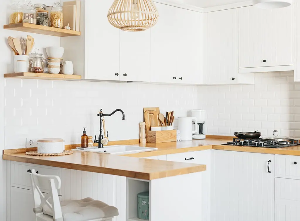 Go for a Scandi light fixture in modern cottage kitchen