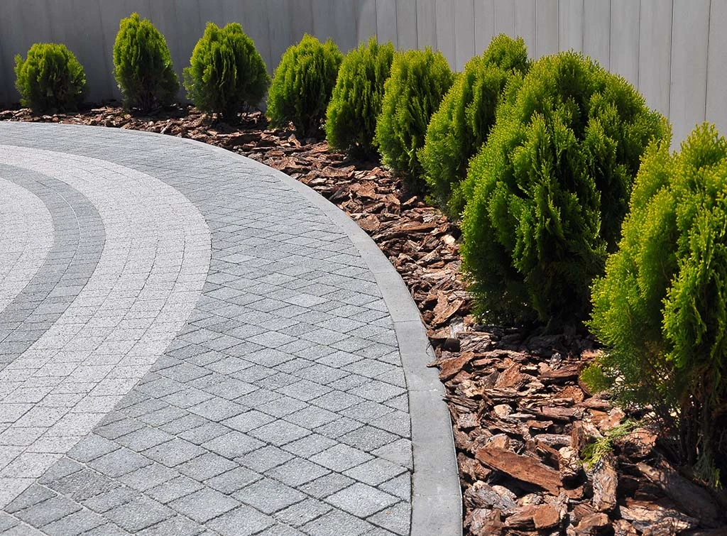 bark and shrubs on driveway
