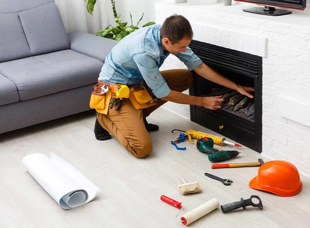 Tradesperson restoring a fireplace