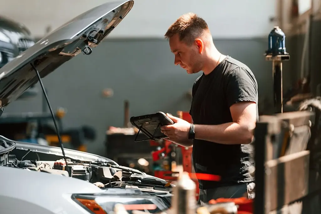 mechanic working on car