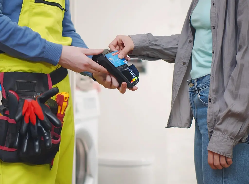https://www.checkatrade.com/blog/wp-content/uploads/2022/02/how-to-start-taking-card-payments-paying.jpg