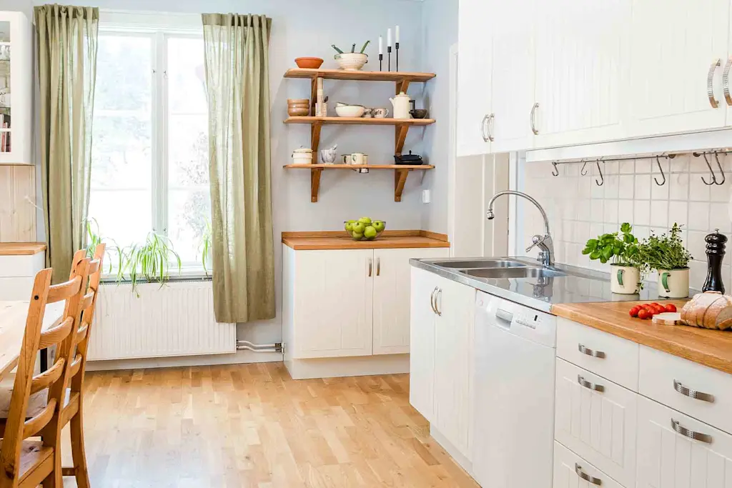 cream colour kitchen cabinet ideas with greenery