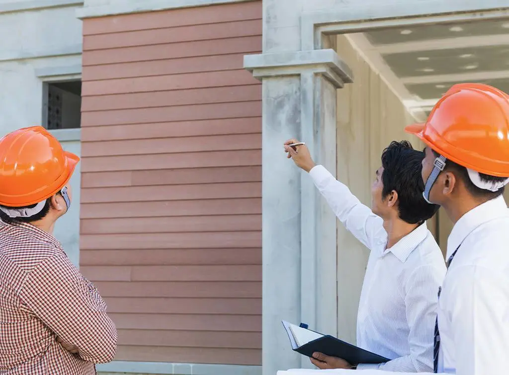 Retrofit Coordinator inspecting building