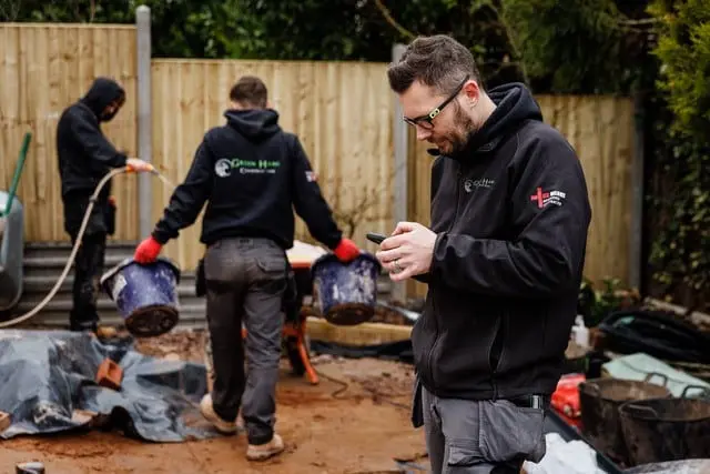 https://www.checkatrade.com/blog/wp-content/uploads/2024/02/green-hawk-construction-team.jpg