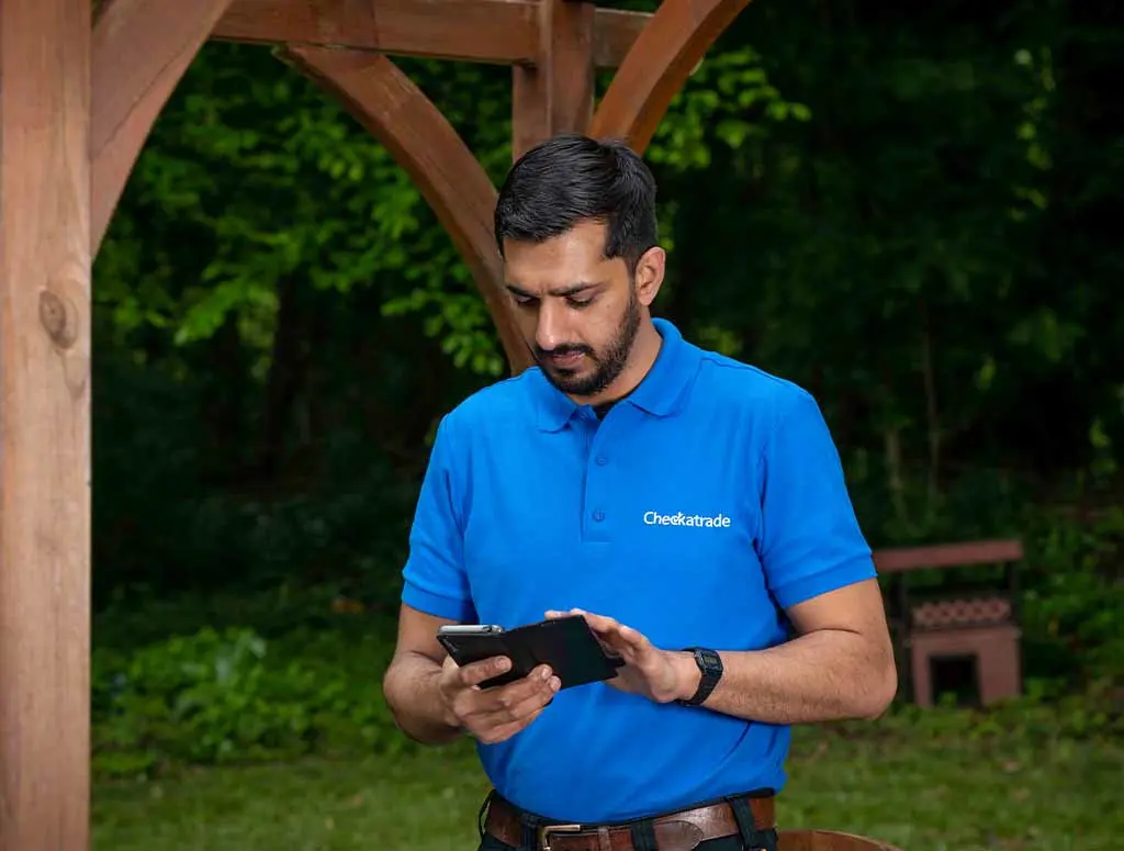 https://www.checkatrade.com/blog/wp-content/uploads/2024/01/checkatrade-member-using-trade-app.jpg