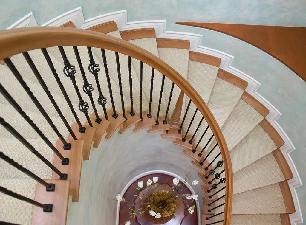 Metal spindles with wooden railing and staircase