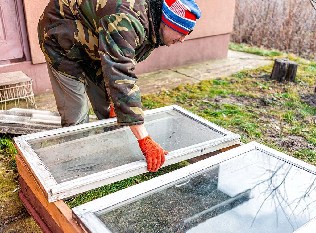 https://www.checkatrade.com/blog/wp-content/uploads/2023/09/making-a-cold-frame-from-old-windows-1.jpg
