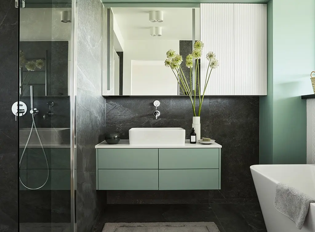 https://www.checkatrade.com/blog/wp-content/uploads/2024/01/bathroom-wall-ideas-match-paint-with-vanity.jpg