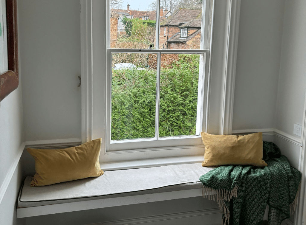 A bespoke window seat on the first-floor landing
