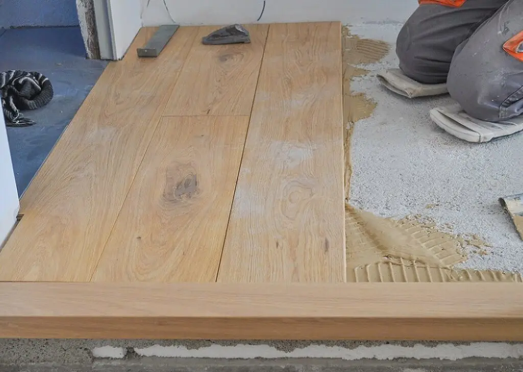 https://www.checkatrade.com/blog/wp-content/uploads/2025/01/fixing-a-wooden-floor-1024x730.jpeg