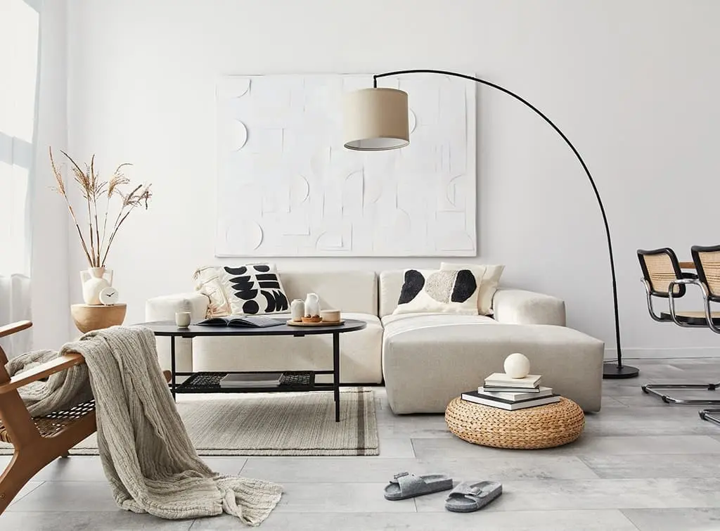 Arched floor lamp in a neutral living room