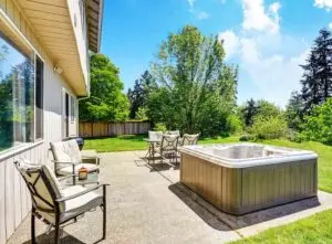Hot tub in a sunny back garden for a spa holiday