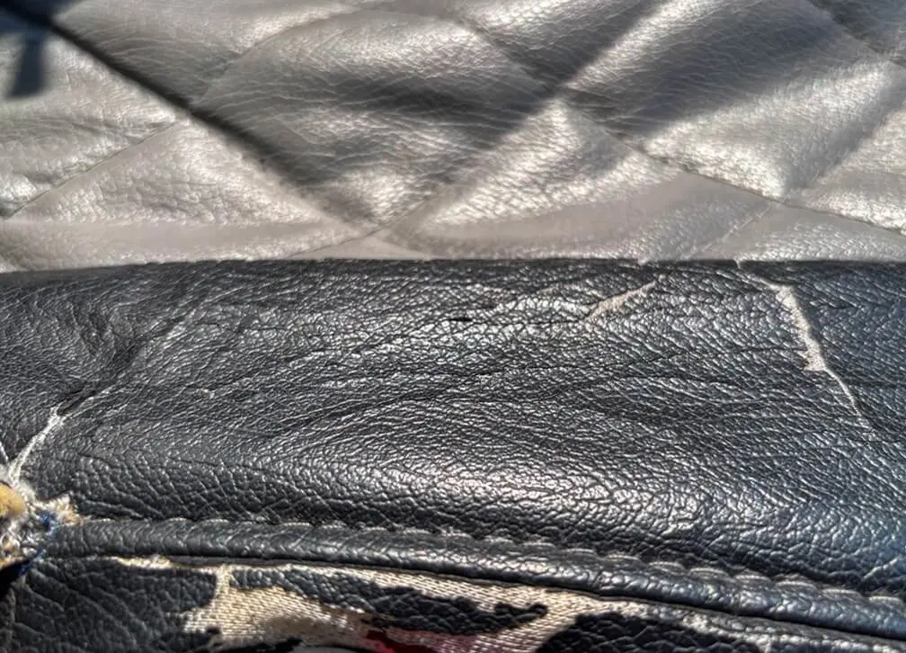Close up of leather car seat needing repair