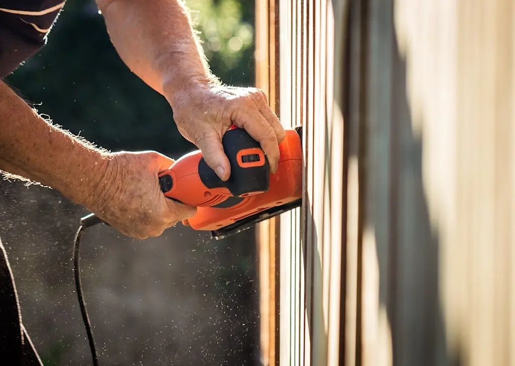 Sanding new fencing slats
