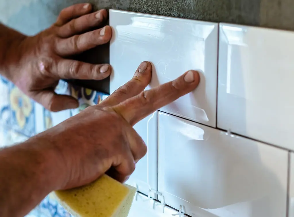 https://www.checkatrade.com/blog/wp-content/uploads/2023/09/bathroom-tiler-upskilling.jpg