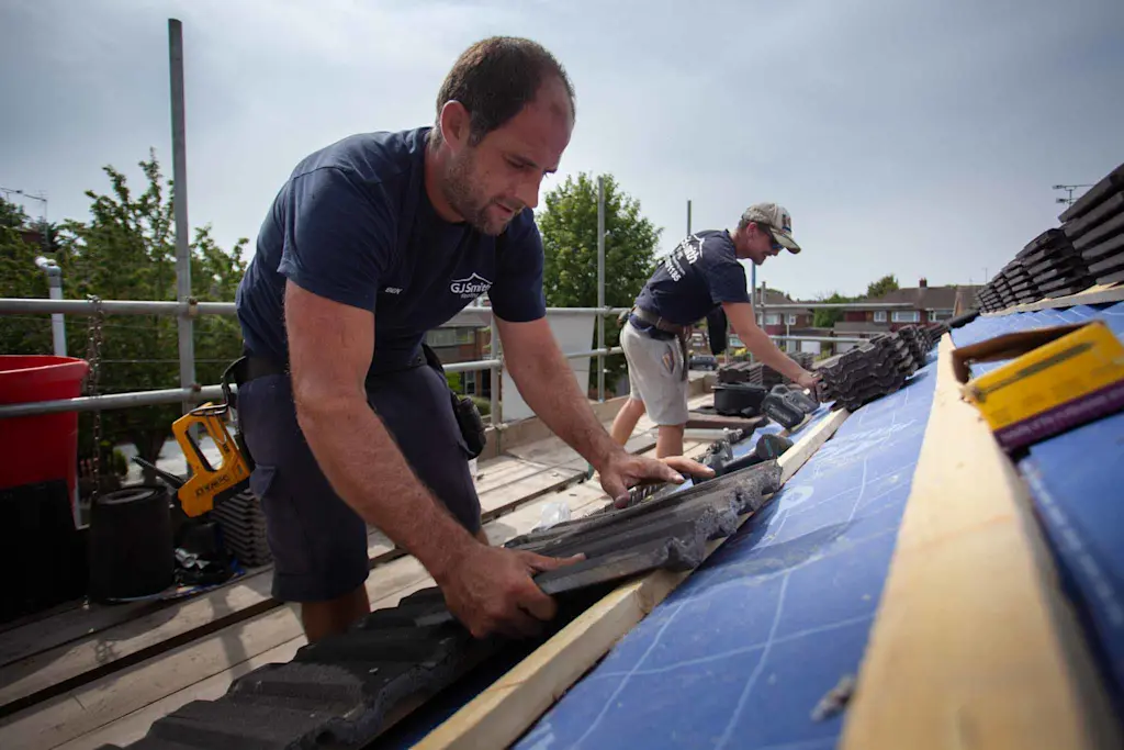 Replacing a roof with new tiles