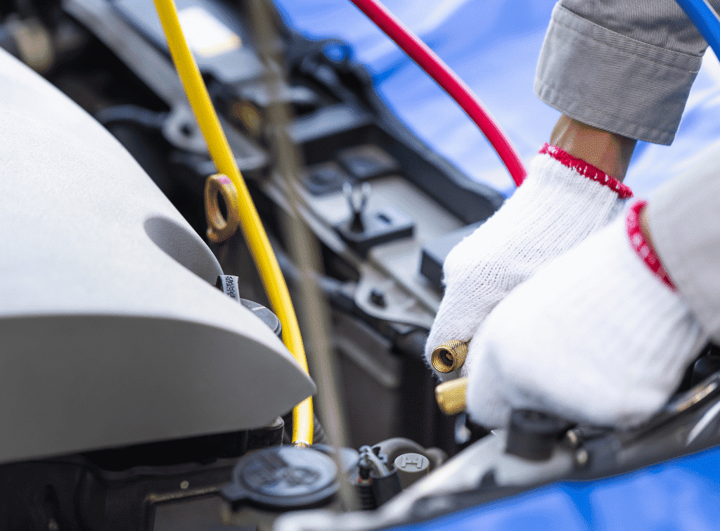 Auto electrician working on a car