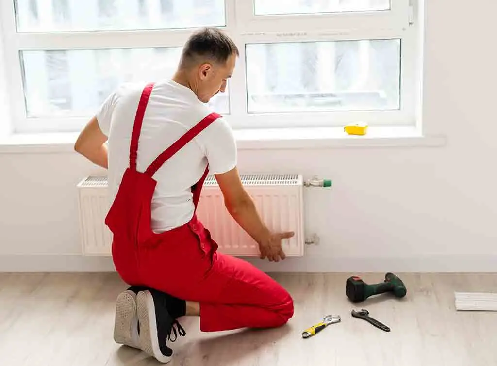 Use a plumber to move radiators