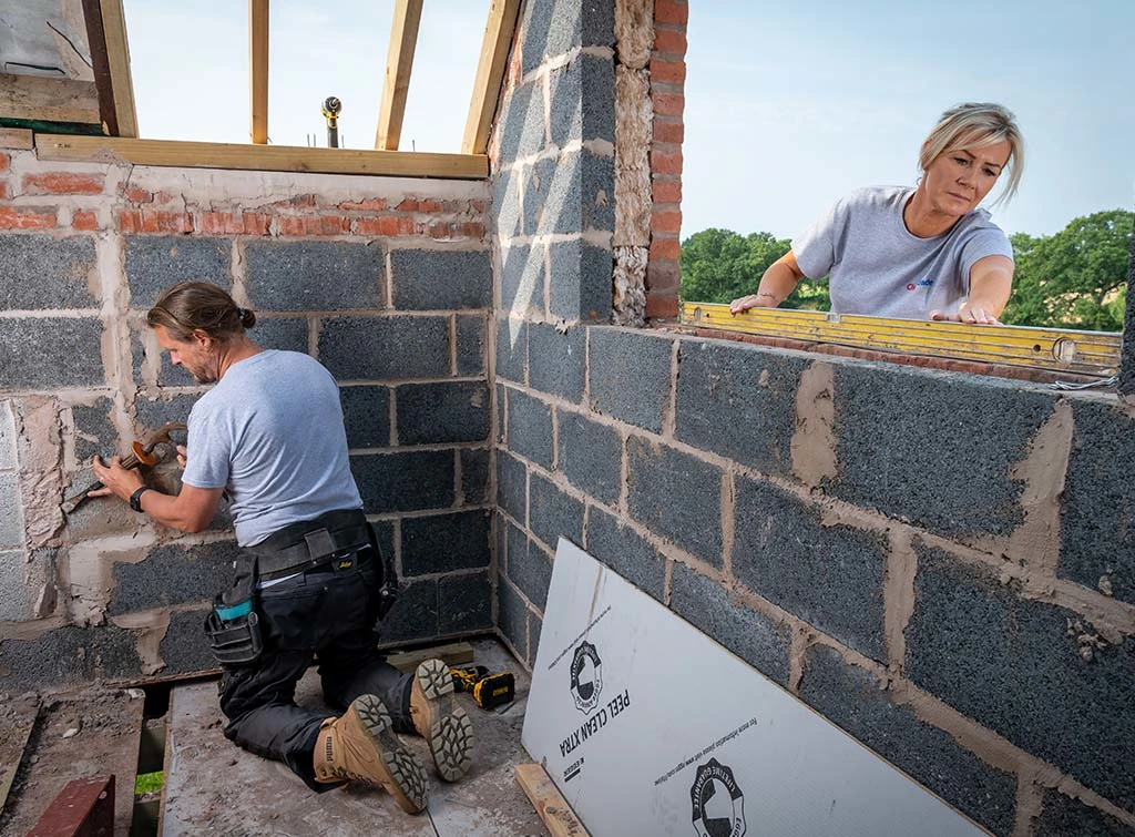 https://www.checkatrade.com/blog/wp-content/uploads/2023/05/iFurb-builders-and-renovation-experts-working-onsite.jpg