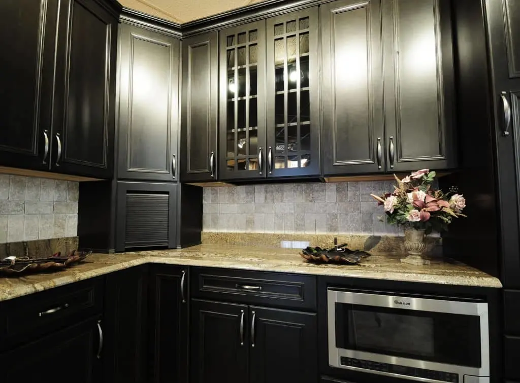 Black kitchen cabinets with glass panelled doors
