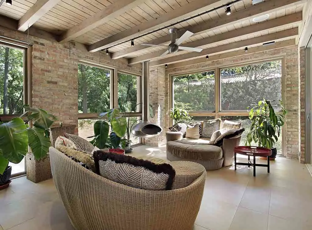 Rustic sunroom with tub furniture