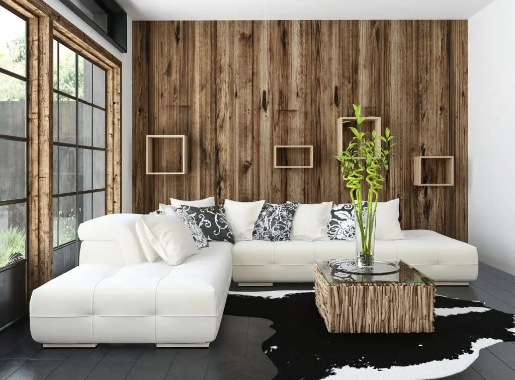 Small garden summer house ideas - white sofa with wood panelled walls