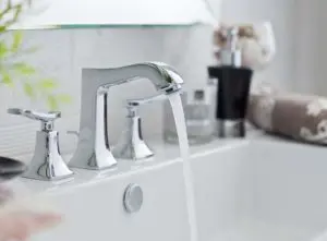 Bathroom tap running in a sink not draining