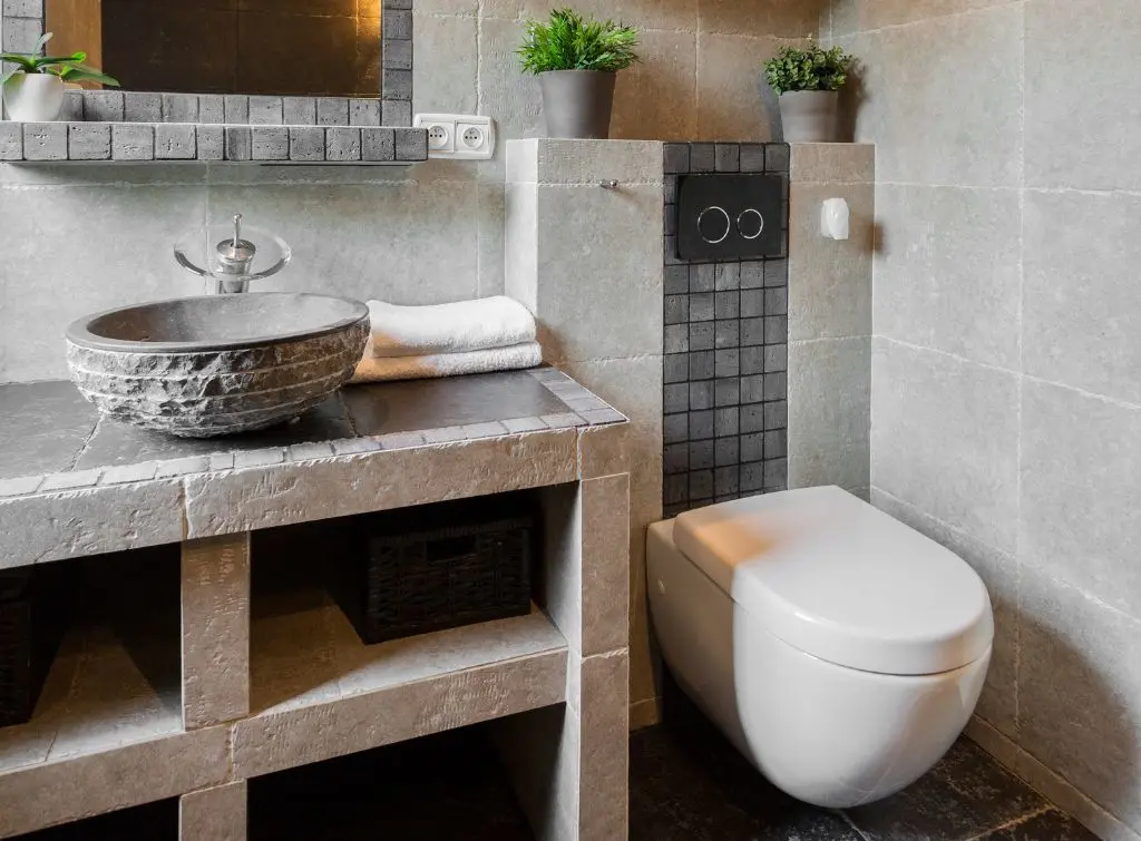 Wall hung toilet and stone decor