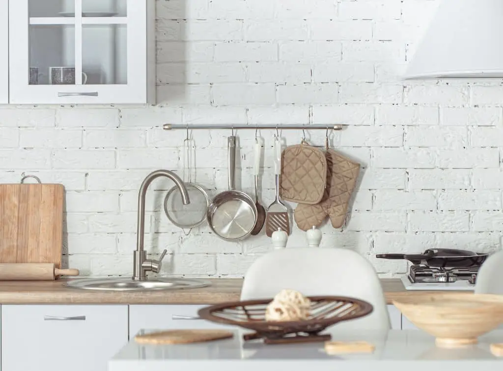 White open brick rustic kitchen idea