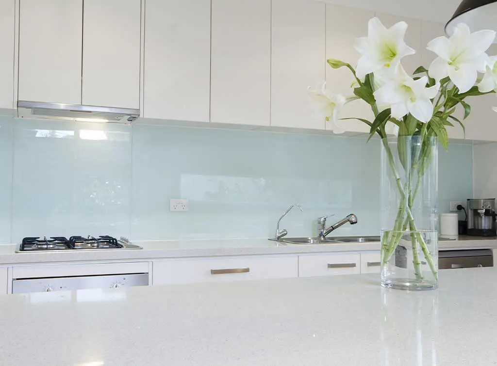 acrylic splashback in a white, clean kitchen