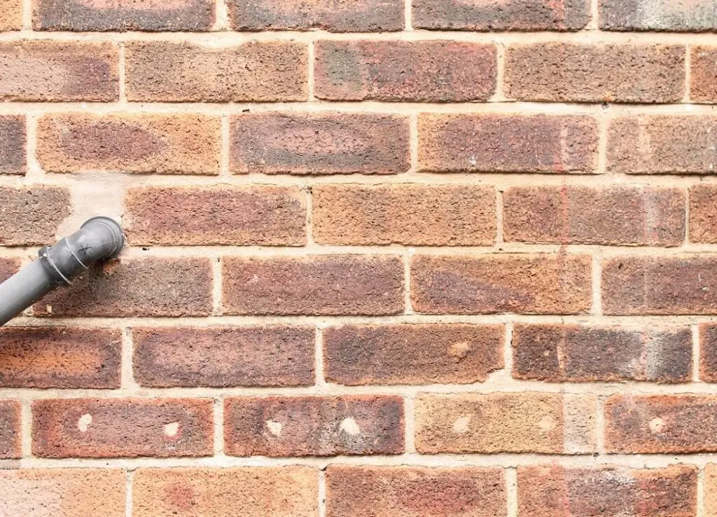 https://www.checkatrade.com/blog/wp-content/uploads/2025/02/cavity-insulation-drill-holes-1024x738.jpeg