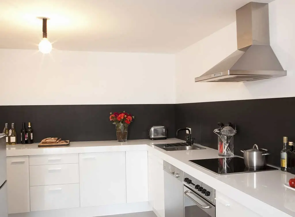 Grey painted kitchen splashback