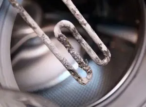 Hard water scale build up on washing machine element