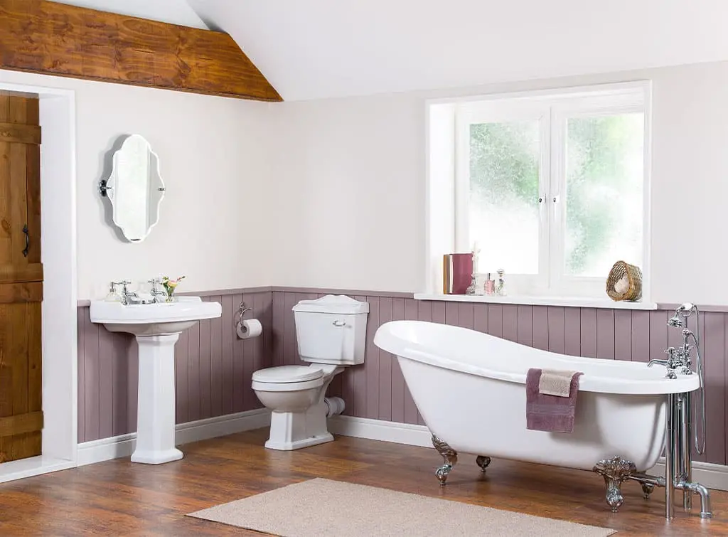 Victorian inspired bathroom with purple walls and wood panelling