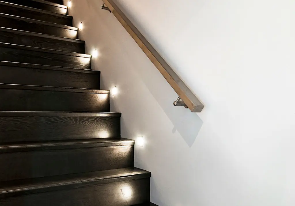 staircase-dark-wood-wall-handrail-lights