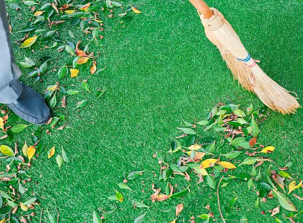 Artificial grass maintenance brush