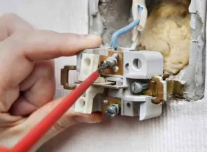 Dimmer switch wiring being repaired