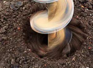 A drilling drilling into the ground - average cost to dig a well