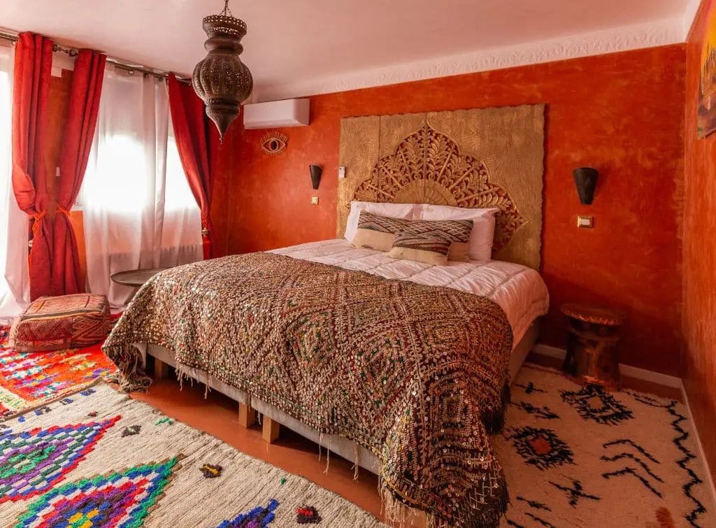 Bright and warm reds complement the colourful contrast of bohemian interiors