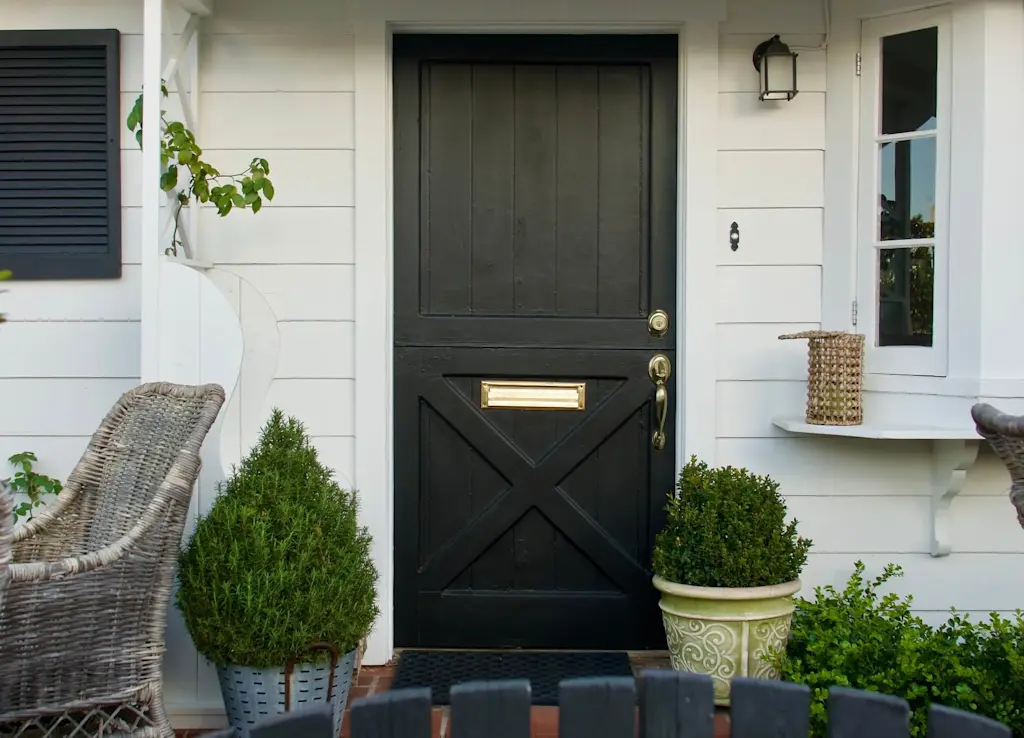 Black composite stable door - solid design with gold door furniture
