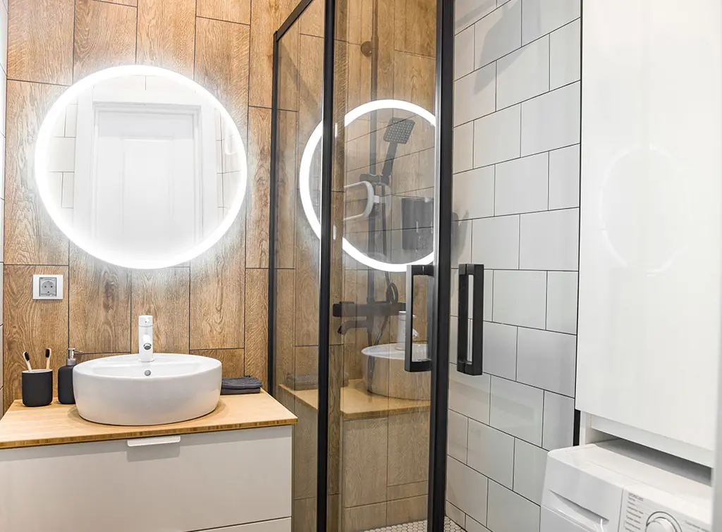 small bathroom with mirror and lighting