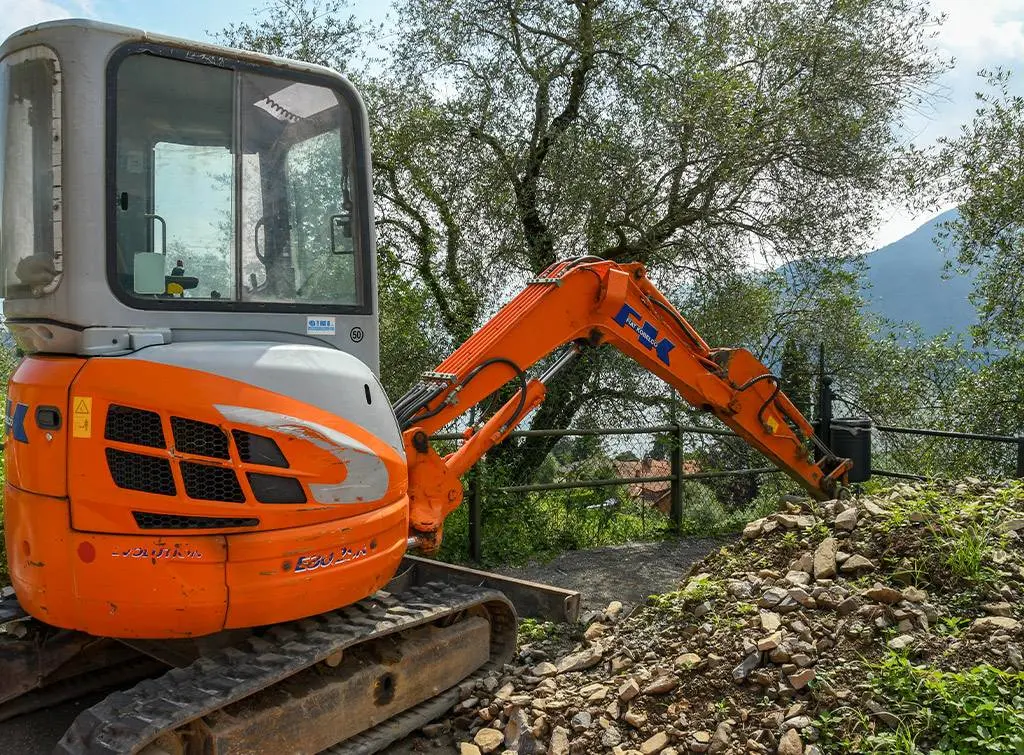 mini digger onsite in garden