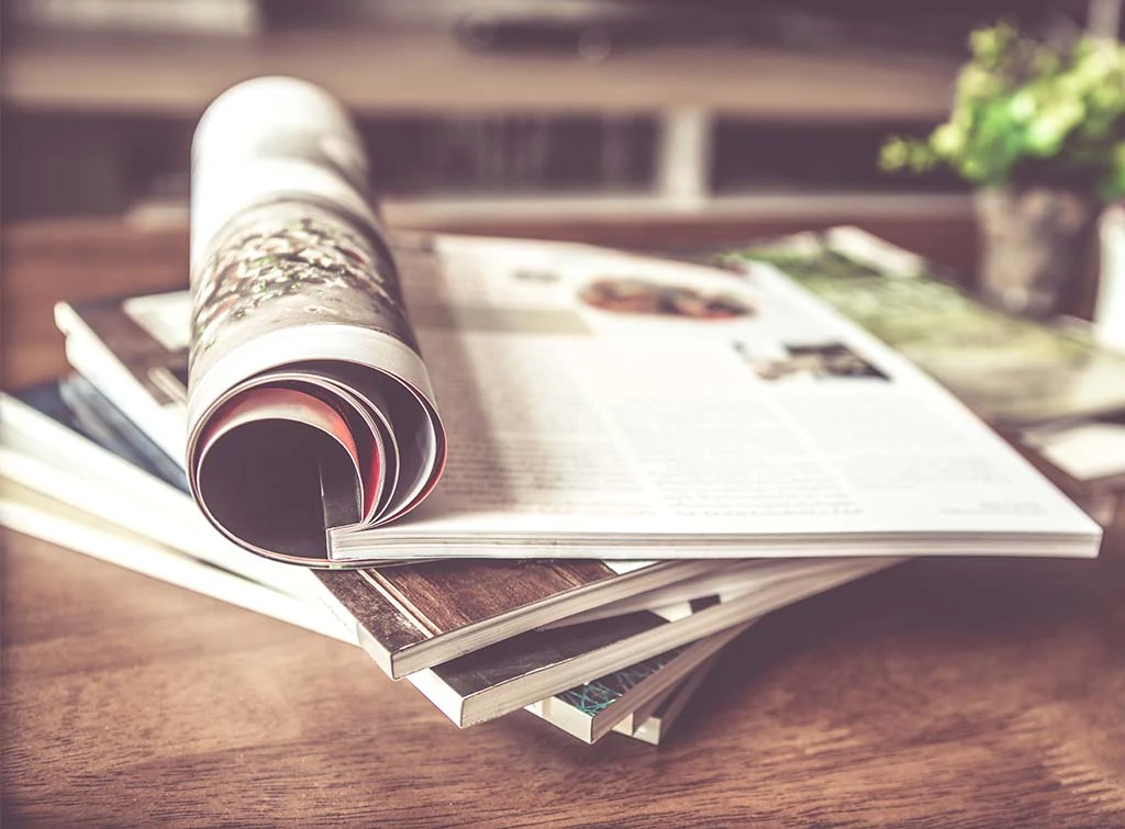 stack of magazines on a table