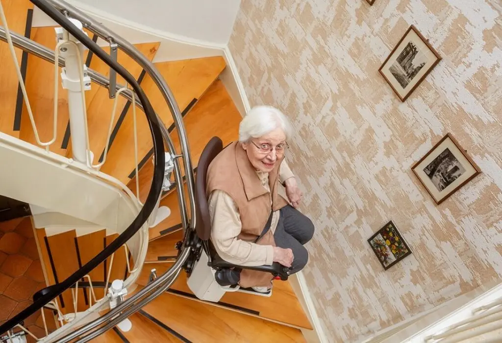 Lady using stairlift in home