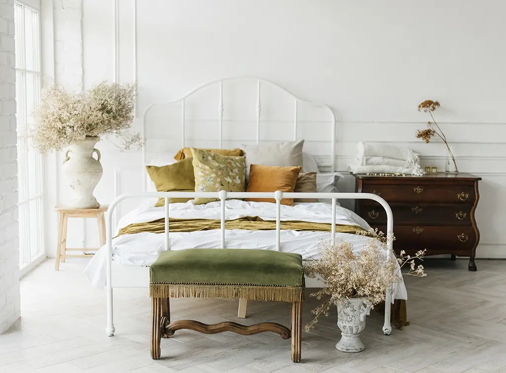 Cast iron bedframe in vintage bedroom