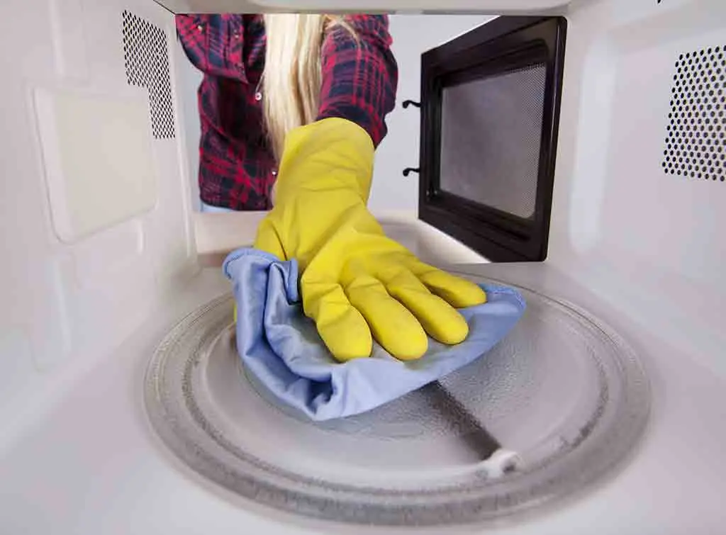Wiping the inside of a microwave